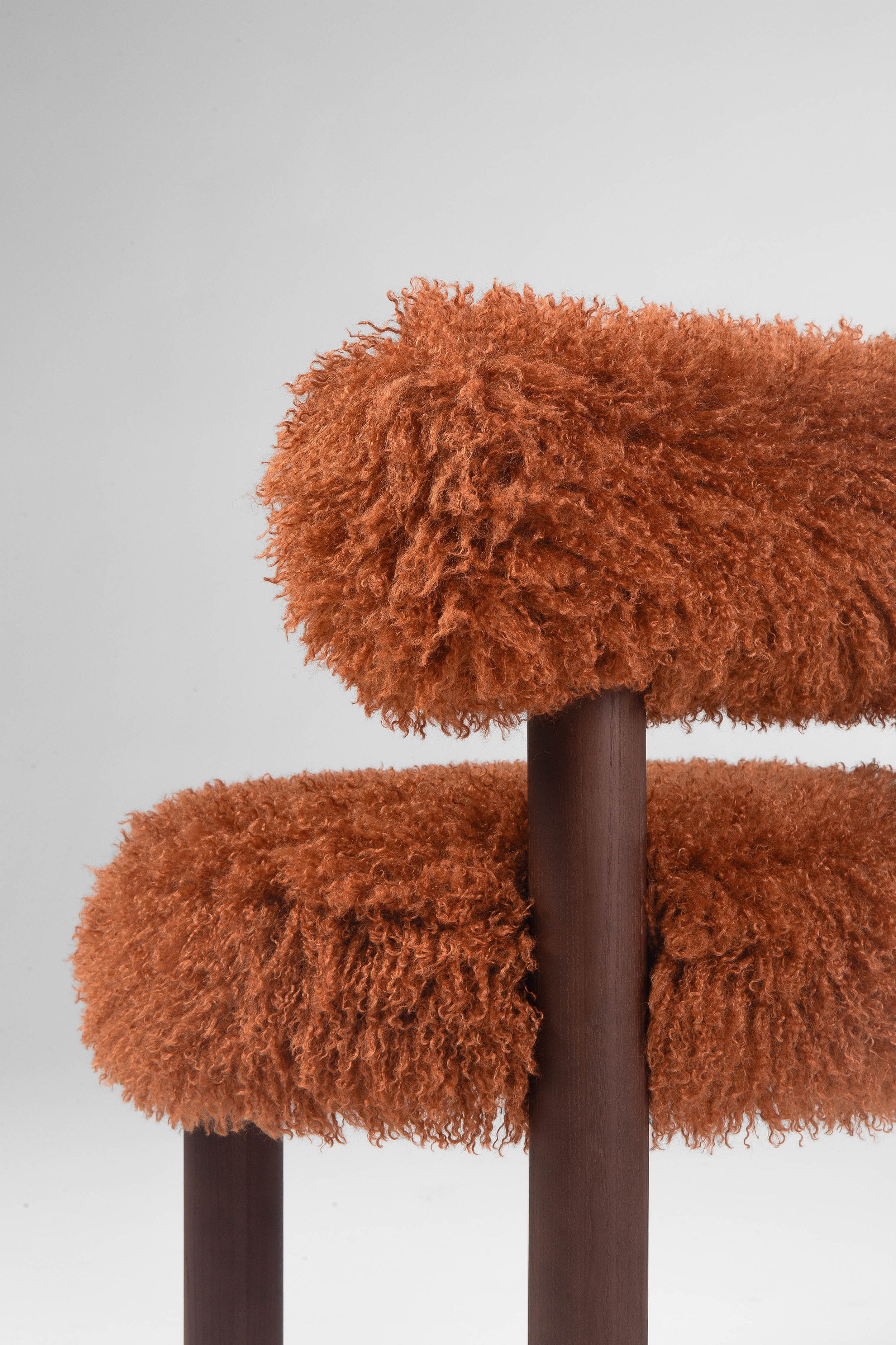 A brown chair with legs made of brown ashwood
